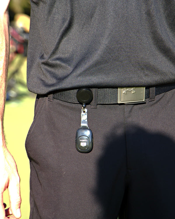 The Clippar clicker on a retractable badge reel clipped to a golfer's belt
